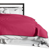 Liberator Fascinator King throw in Merlot spread across a bed, showing its drape and edging