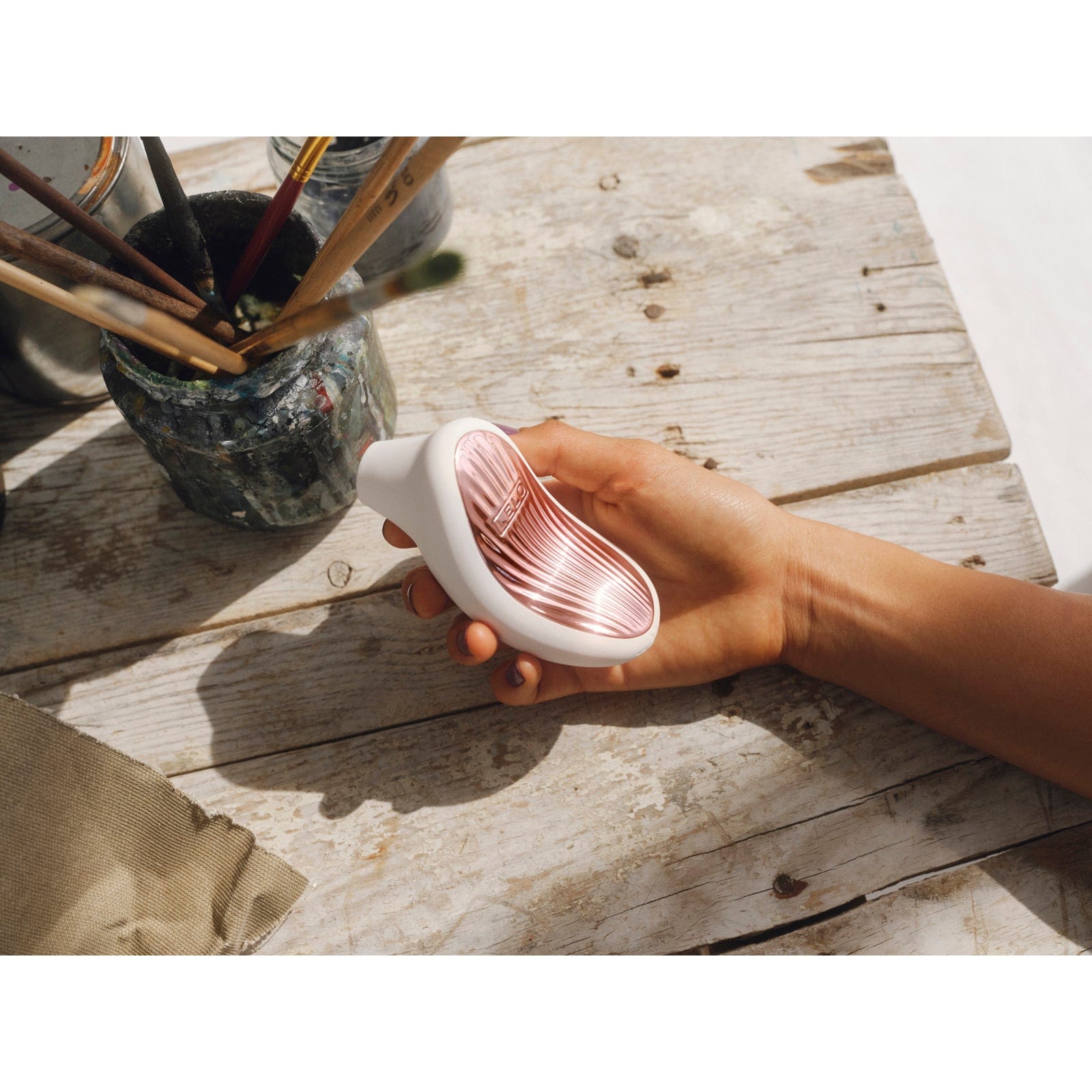 LELO SONA 3 held in hand for external positioning
